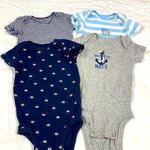 Four Carter’s boys short sleeve onesies size 12 months
